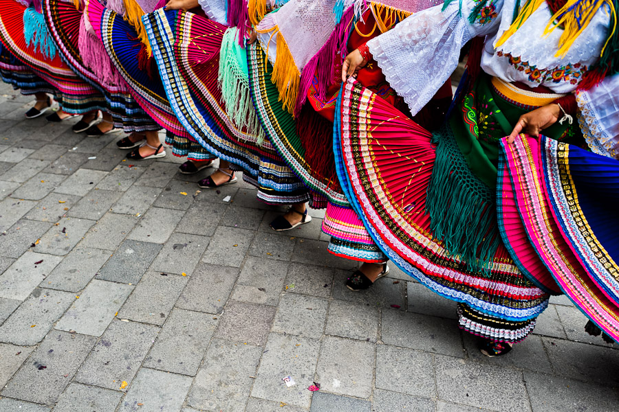 Woman dancers (danzantes) perform in the religious parade within the Corpus Christi festival in Pujilí, Ecuador.