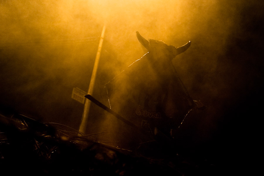 A dancer, masked as a bull, performs during the night before the religious festival of Corpus Christi in Pujilí, Ecuador.