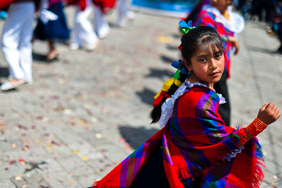 A girl dancer (danzante) performs in the religious parade within the Corpus Christi festival in Pujilí, Ecuador.
