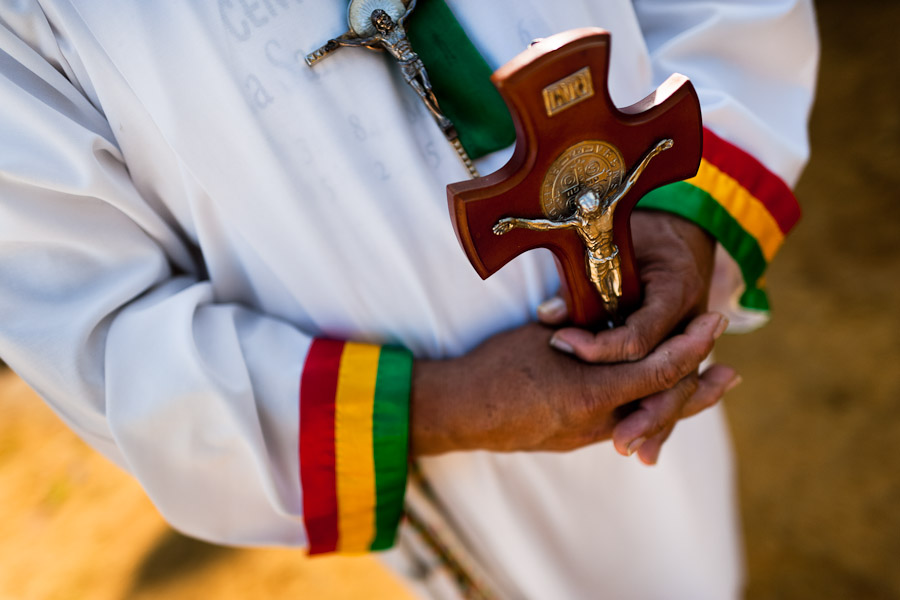 Hermes Cifuentes, a Colombian spiritual healer, helds a crucifix in his hands during a ritual of exorcism in La Cumbre, Colombia.