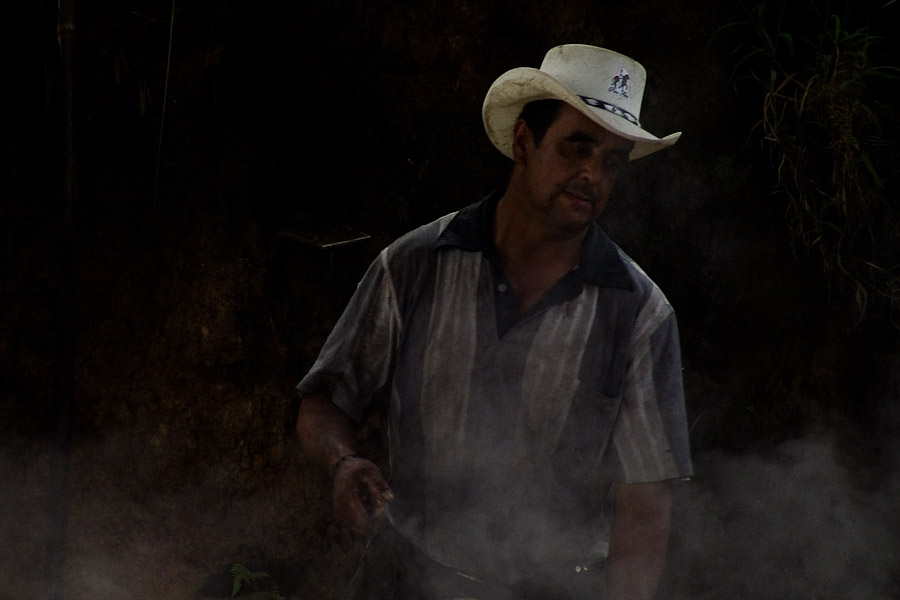 A Colombian farmer Ramiro Burbano controls the processing of panela in a rural sugar cane mill (trapiche) in San Agustín, Colombia.