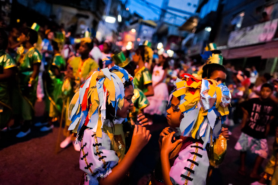 Brazilian children, wearing colorful costumes, take part in the Carnival parade in the favela of Rocinha, Rio de Janeiro, Brazil.