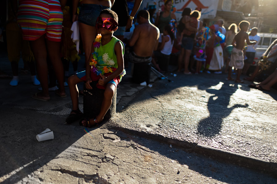 A Brazilian boy, wearing a carnival mask, takes part in the Carnival parade in the favela of Rocinha, Rio de Janeiro, Brazil.