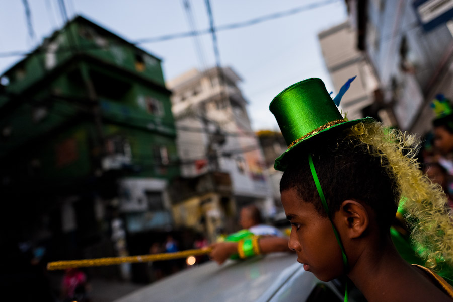 A Brazilian boy, wearing a colorful costume, takes part in the Carnival parade in the favela of Rocinha, Rio de Janeiro, Brazil.