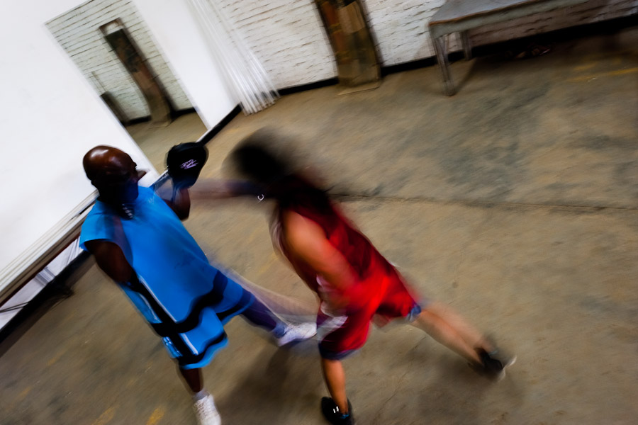 Geraldin Hamann, a young Colombian boxer, is seen during a sparring workout with her coach in the boxing gym in Cali, Colombia.