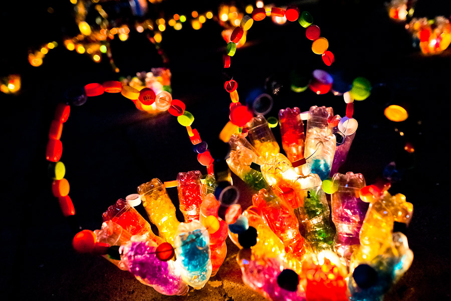 Colorful basket-shape sculptures, made of empty plastic bottles and bottle caps, illuminate the street during the annual Festival of Candles and Lanterns in Quimbaya, Colombia.