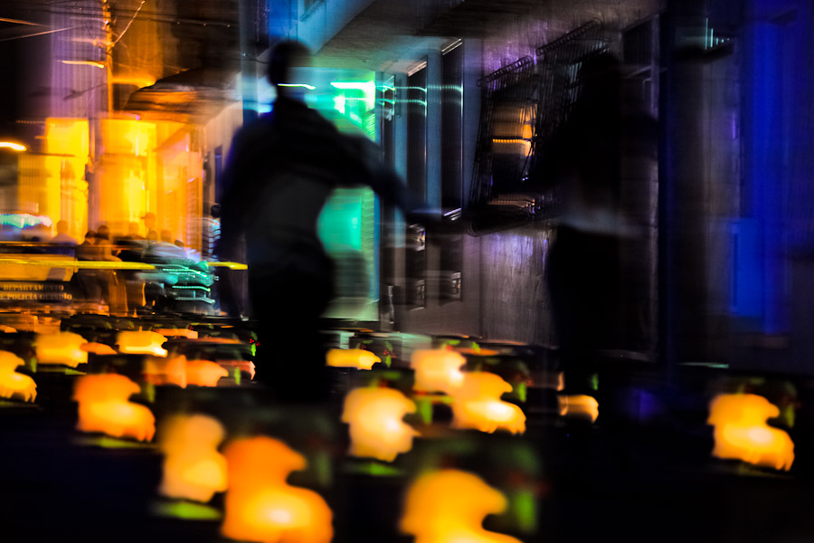 A Colombian man walks amongst the colorful paper lanterns, illuminating the street during the annual Festival of Candles and Lanterns in Quimbaya, Colombia.