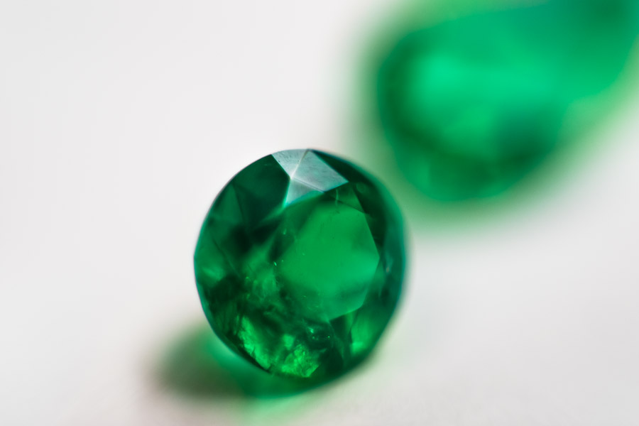 A fine round-shaped emerald, having a value of $5,000-10,000, is seen in the jewelry workshop in Bogota, Colombia.