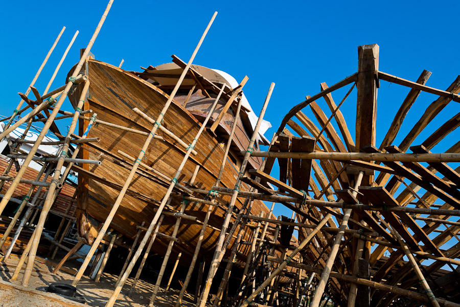 Traditional wooden fishing vessels are seen being built in an artisanal shipyard on the beach in Manta, Ecuador.