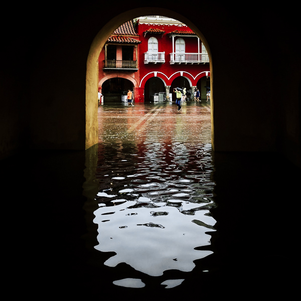The Clock Tower gate, the entrance to the colonial walled city, is seen flash flooded by a heavy rain storm during the annual rainy season in Cartagena, Colombia.