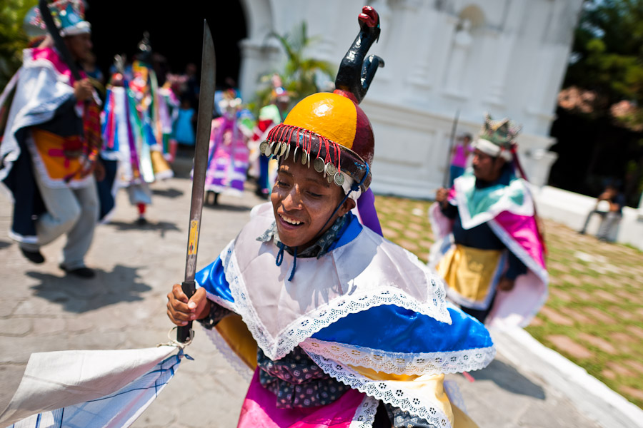 Members of a dance group “Los Historiantes” perform the Dance of the Moors and Christians during the Flower & Palm Festival in Panchimalco, El Salvador.