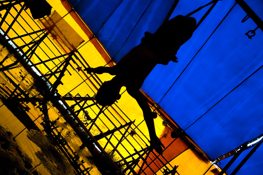 Raimundo, a nine-year old Colombian boy, performs a flying trapeze act at the Circus Anny.