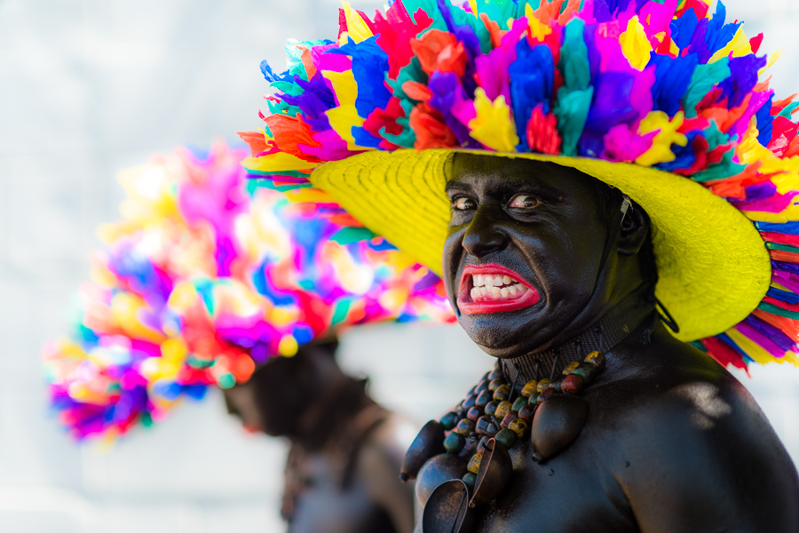 An Afro-Colombian man, a member of the folkloric group Son de Negro, shows an emotional grimace during the preparations for the parade of the Carnival in Barranquilla, Colombia.