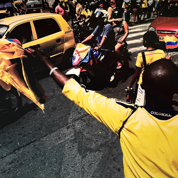 A Colombian man sells football fan flags on the street in Cali, Colombia.