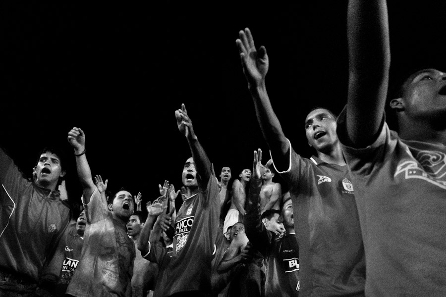 Colombian football fans sing a chant during the match at the América de Cali football club stadium in Cali, Colombia.