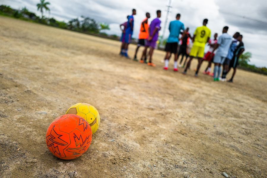 Young Afro-Colombian men perform daily training on a dirt field outside Quibdó, Colombia.