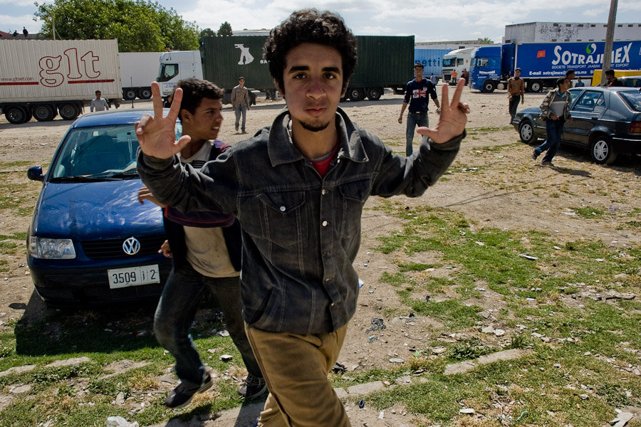 The parking place in front of Tanger's port for trucks heading to Europe attracts the immigrants' attention.