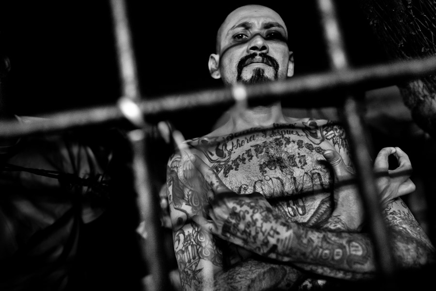 A local gang leader (palabrero) of the Mara Salvatrucha gang shows a hand sign in the prison in San Salvador, El Salvador.