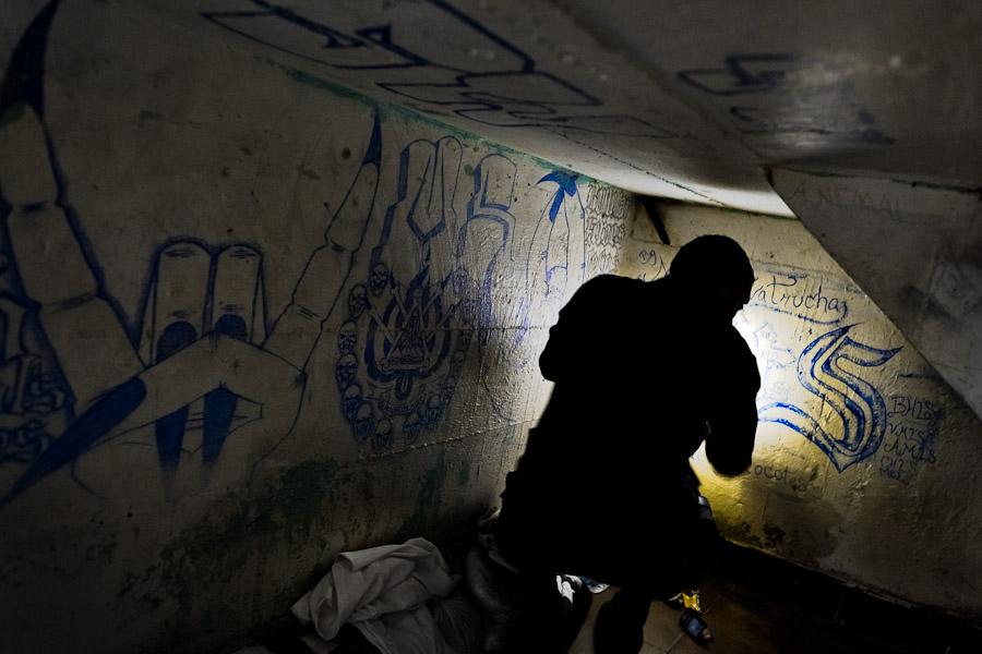 A prison guard searches for drugs and weapons in a Mara gang members cell during a cell search at the detention center in San Salvador, El Salvador.