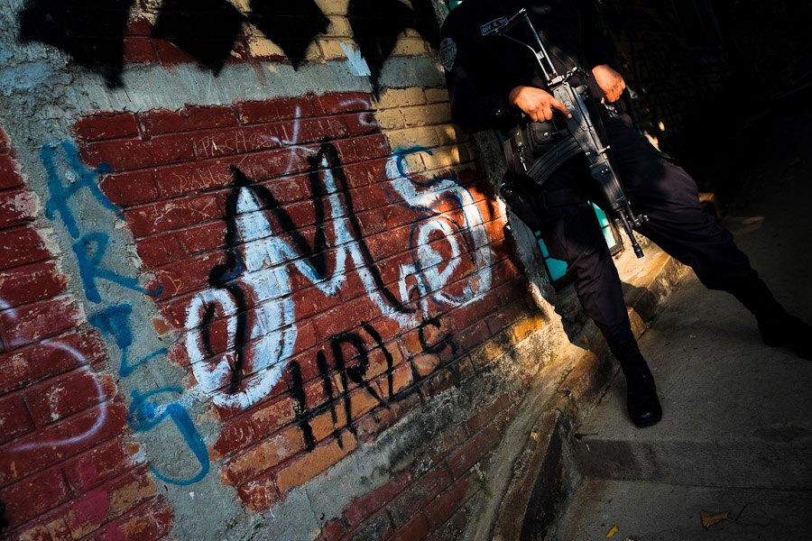 A policeman from the special emergency unit (Halcones) patrols in a gang neighbourhood of San Salvador, El Salvador.