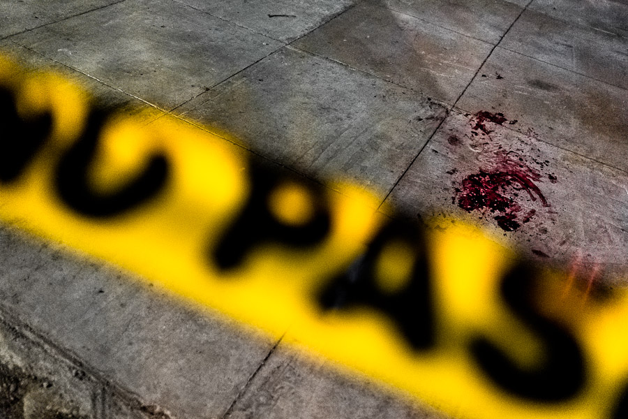 A pool of blood seen on the floor after a shooting incident between gang members and police on the street in a gang neighbourhood of San Salvador, El Salvador.