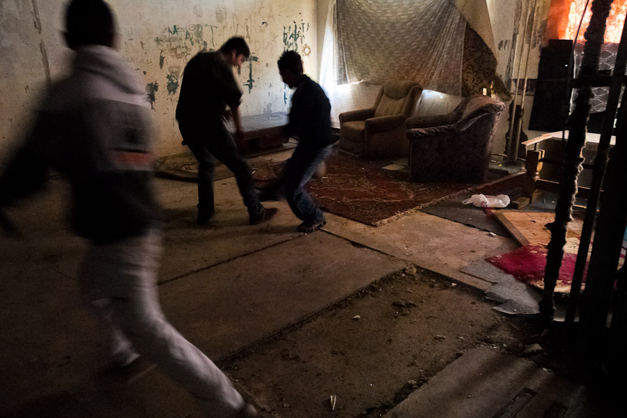 Young Gipsy boys play football inside a devastated apartment block in the Gipsy ghetto of Chanov.