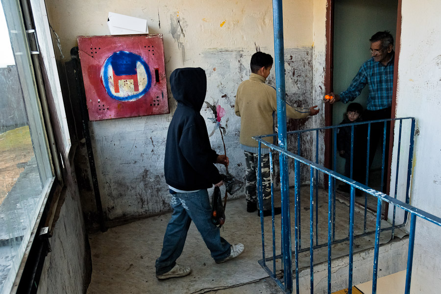 Gipsy kids are waiting in front of the door to be given hard-boiled eggs during the Easter Monday.