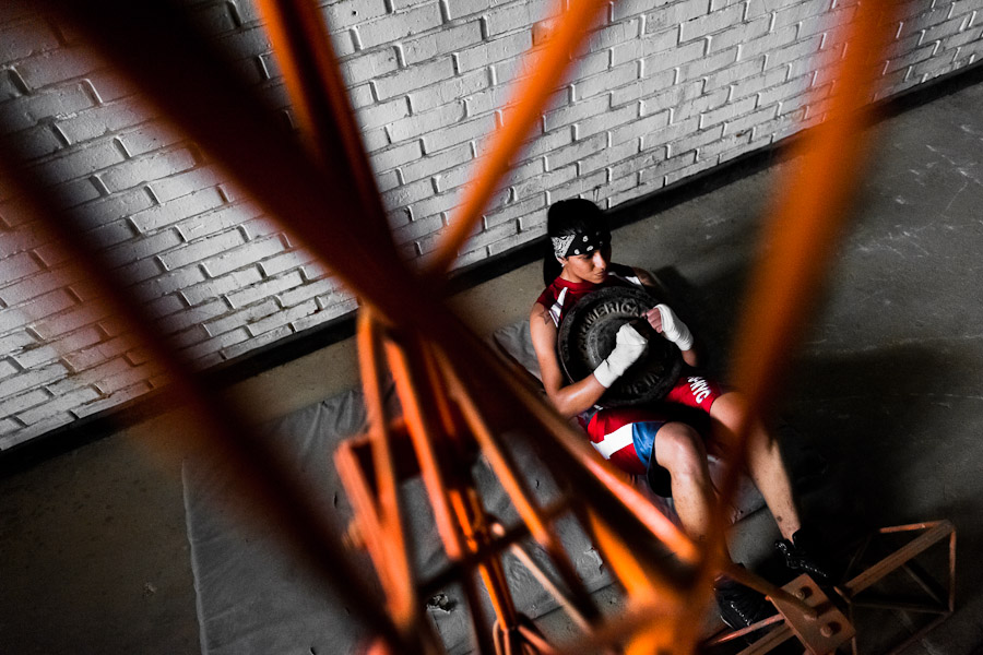 Geraldin Hamann, a young Colombian boxer, is seen during a muscular strength exercise in the boxing gym in Cali, Colombia.