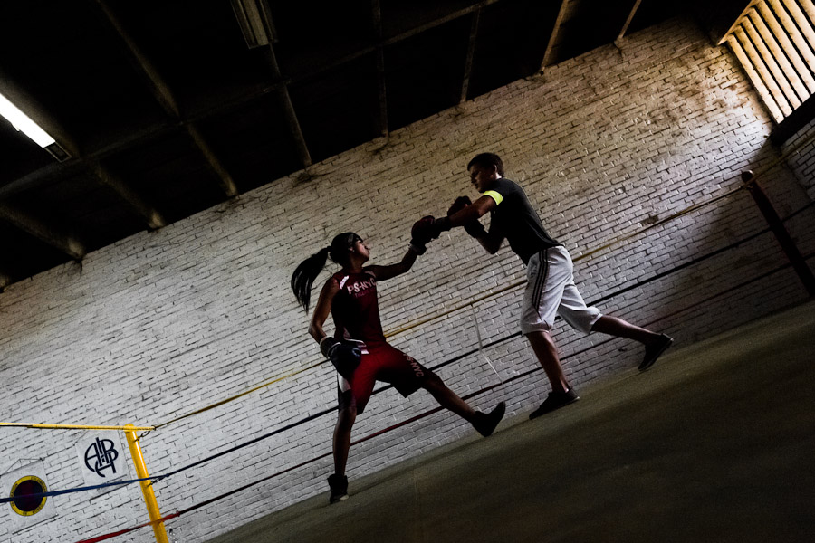 Geraldin Hamann, a young Colombian boxer, practices sparring with a male team mate in the boxing gym in Cali, Colombia.