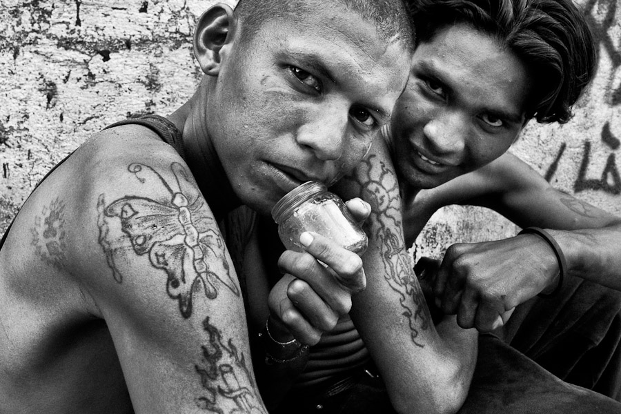 Young Nicaraguan boys living on the street and sniffing the shoe glue, Managua, Nicaragua.