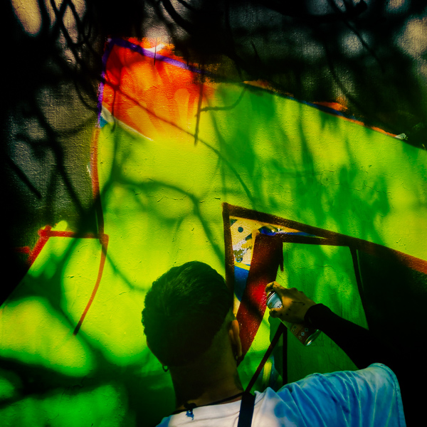 A Mexican street artist paints graffiti on the wall of a cemetery during a graffiti event in Guadalajara, Mexico.