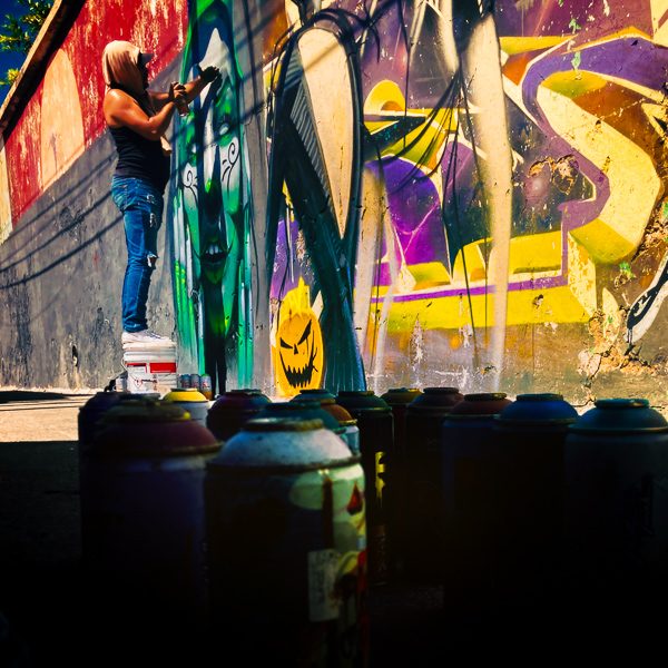 A Mexican street artist paints graffiti on the wall of a cemetery during a graffiti event in Guadalajara, Mexico.