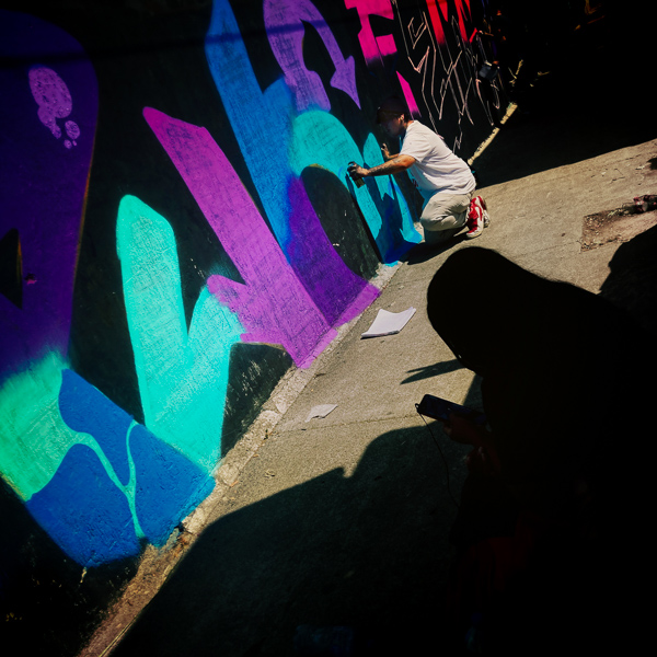 A Mexican street artist paints graffiti on the wall of a cemetery during a graffiti event in Guadalajara, Mexico.