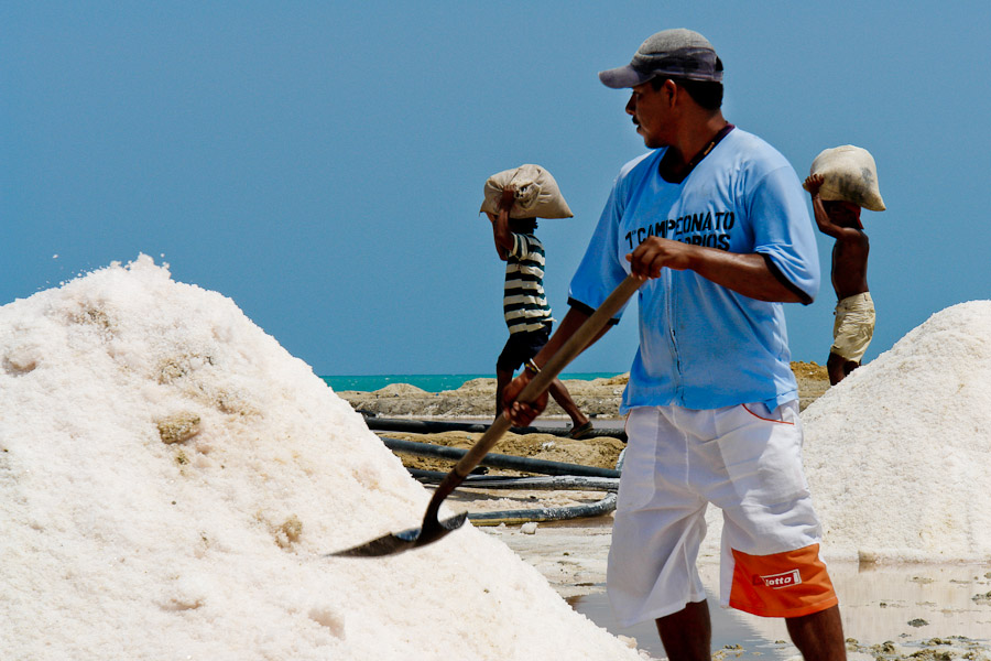 A Colombian worker shoveling salt in the salt mines of Salinas de Manaure, Colombia, 12 May 2006.