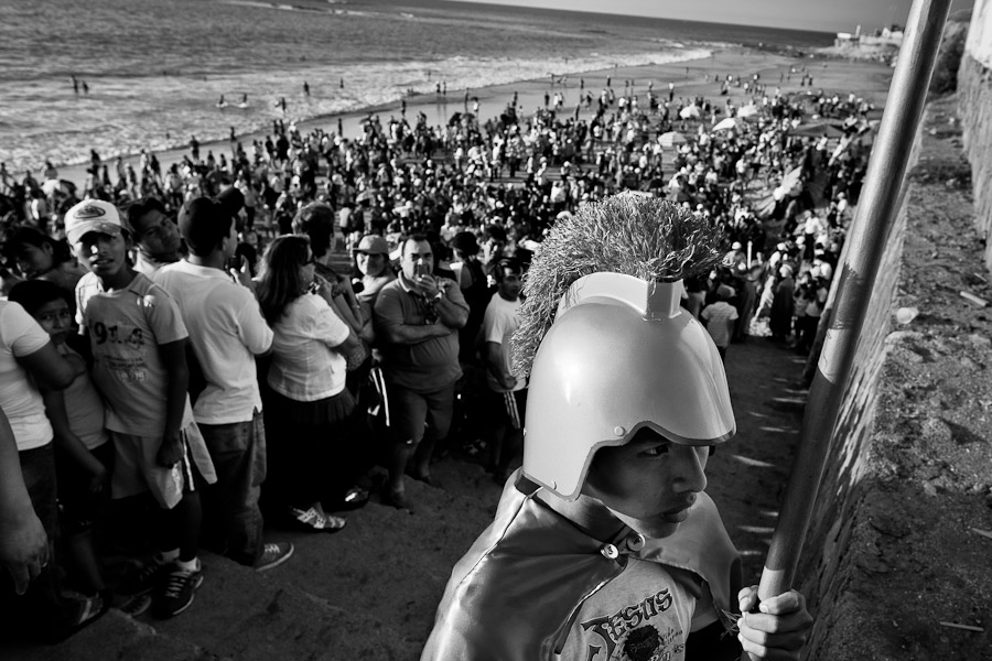 Hundreds of Ecuadoreans wait on the beach to see the traditional Holy Week ritual (Lavado de la cruz).