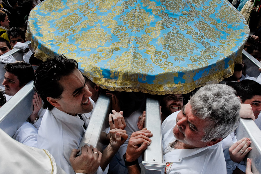 The throne is owned by cofradía, a religious brotherhood, maintained by Church in the neighbourhood. There might be thousands of brotherhood members participating in the procession.