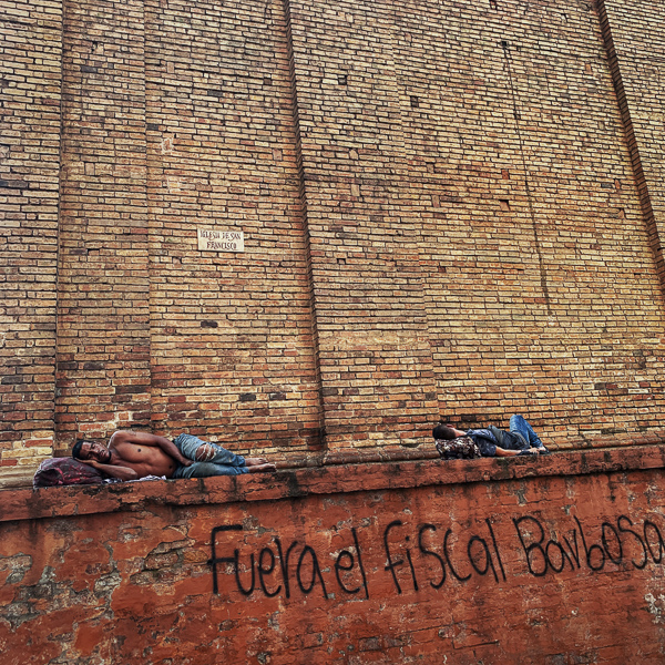 Homeless Afro-Colombian men sleep in front of San Francisco Church in the center of Cali, Colombia.