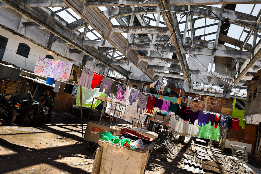 Washed clothes hung out to dry inside an abandoned factory, location of the illegally built apartments, in Rio de Janeiro, Brazil.
