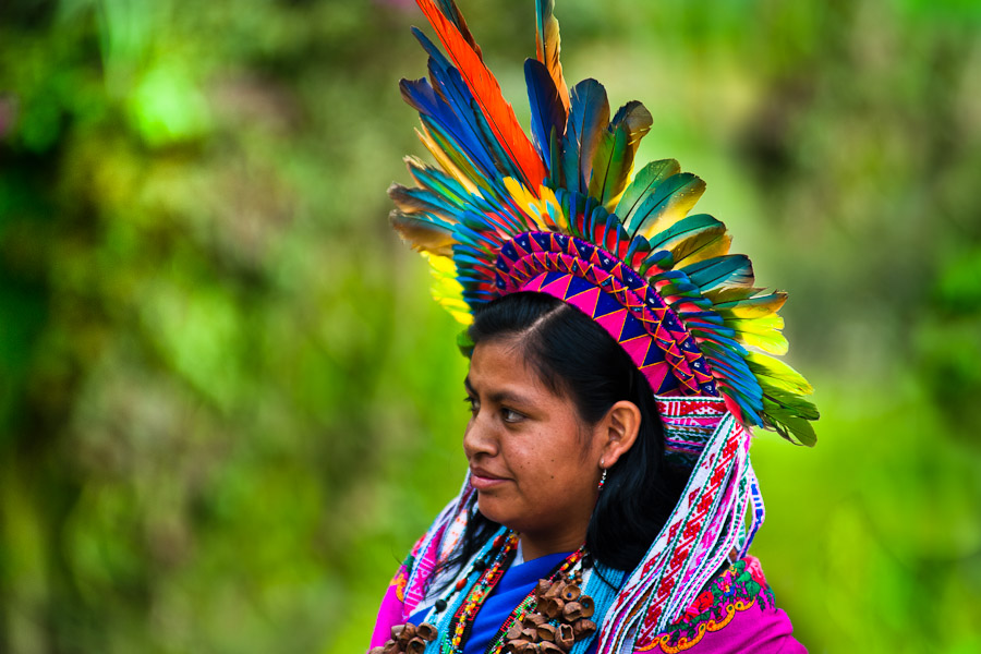 A native from the Kamentsá tribe, wearing a colorful feather headgear, takes part in the Carnival of Forgiveness, a traditional indigenous celebration in Sibundoy, Colombia.