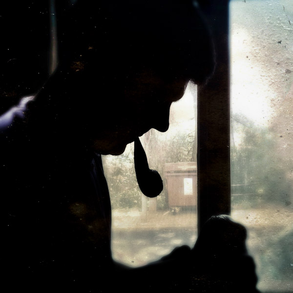 Jan Madiara, a master bow-maker, smokes a pipe while working on a bow in his workshop in Karlovy Vary, Czech Republic.