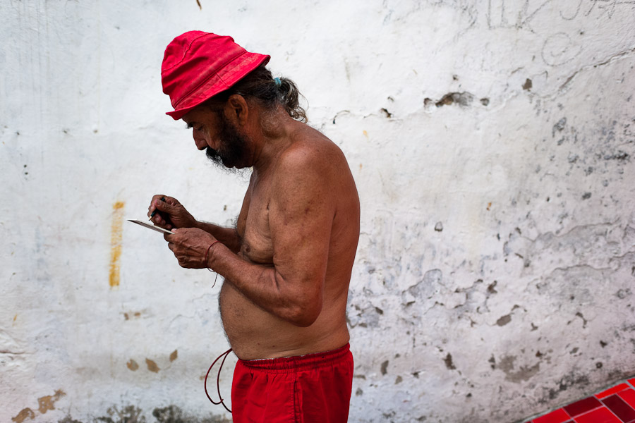 Jorge Selarón, a Chilean-born artist, paints a picture in front of his house on Selaron's Stairs.