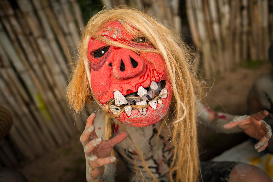 A Salvadoran boy, wearing a mask, performs an indigenous mythology character in the La Calabiuza parade at the Day of the Dead festivity in Tonacatepeque, El Salvador.