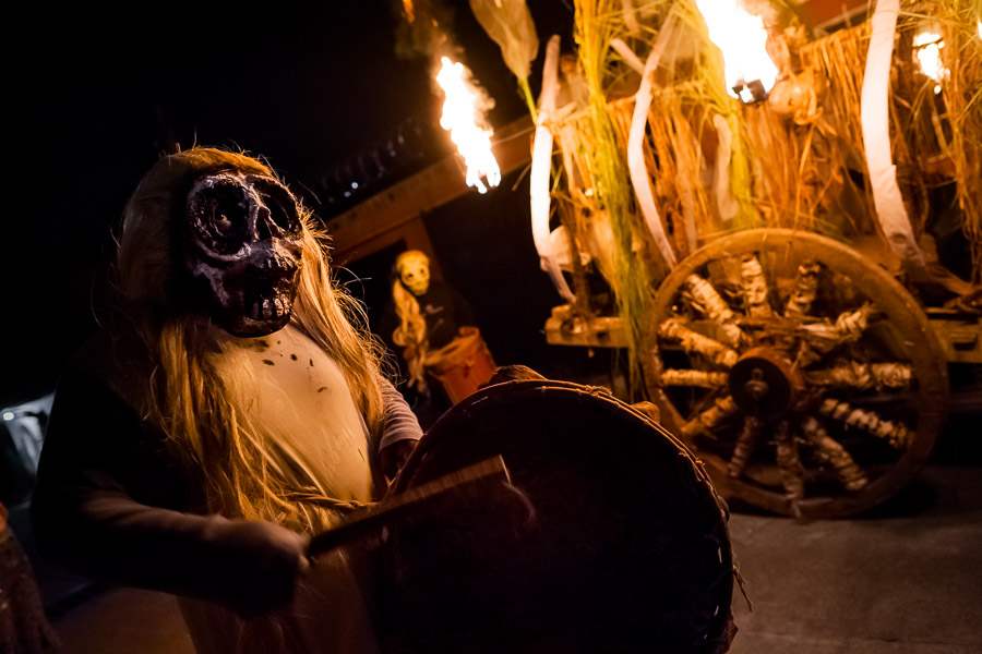 A Salvadoran man, wearing a skull mask, plays drum during the La Calabiuza parade at the Day of the Dead celebration in Tonacatepeque, El Salvador.