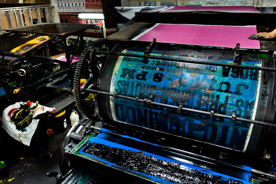 An ancient letterpress machine seen before a new load in the print shop in Cali, Colombia.