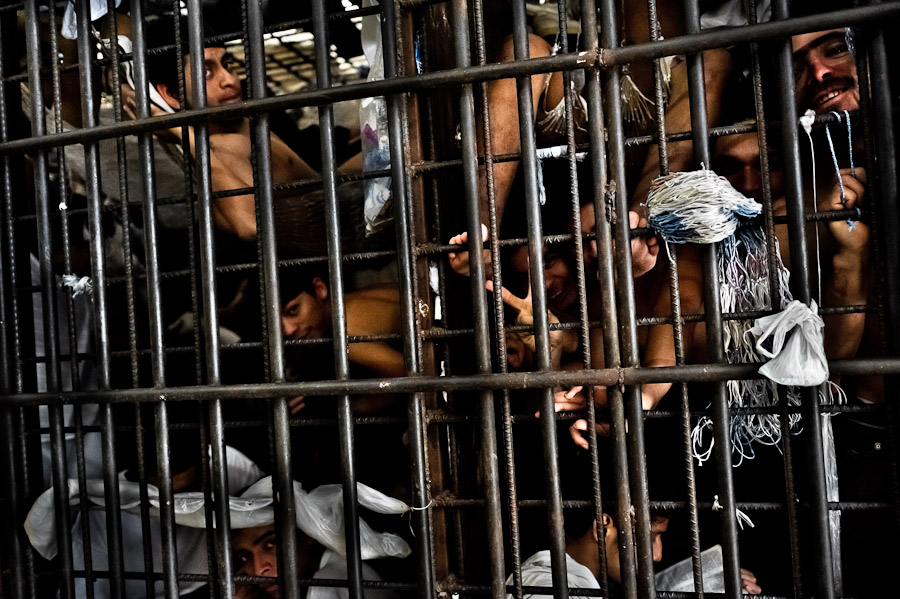 Mara gang members are seen behind the bars of overcrowded cells at the detention center in San Salvador, El Salvador.