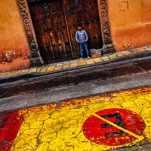 A Mexican Maya boy sells homemade food in the colonial street of San Cristóbal de las Casas, Chiapas, Mexico.