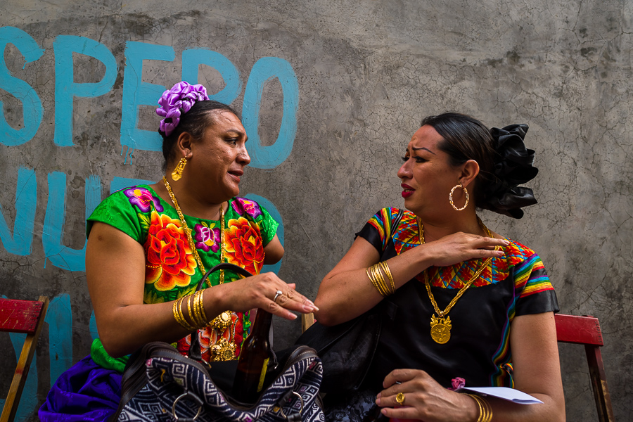 Mexican “muxes” (typically, homosexual men wearing female clothes) speak excitedly during the Vela de las Intrépidas festival in Juchitán de Zaragoza, Oaxaca, Mexico.