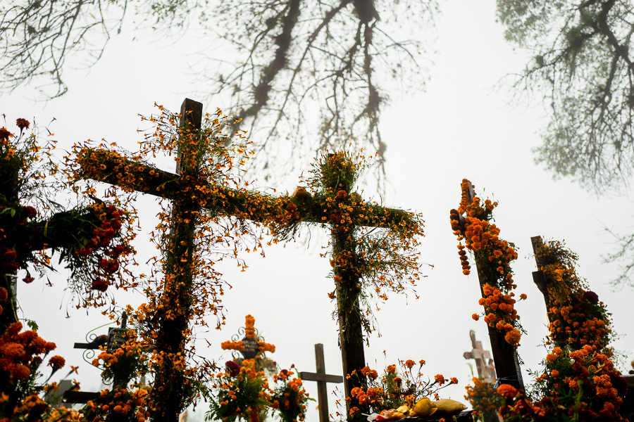 Grave crosses, decorated with marigold flowers, are seen at a cemetery during the Day of the Dead celebrations in Ayutla, Mexico.