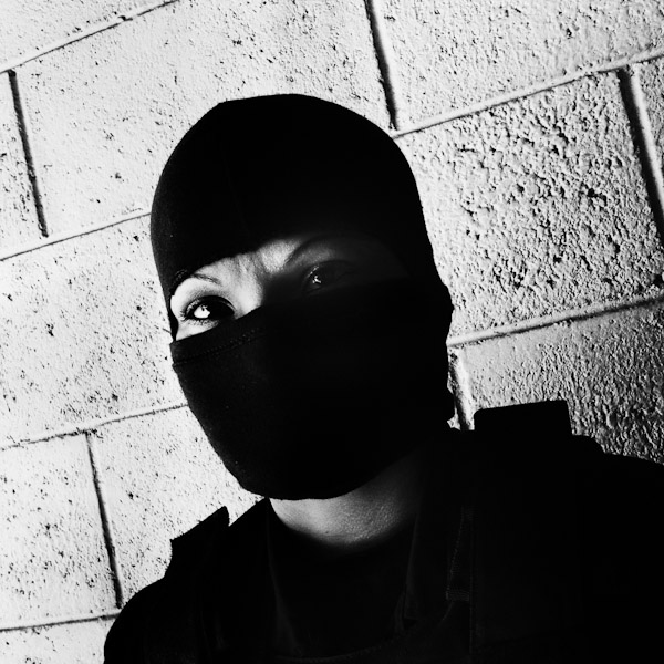 Members of the Police anti-gang unit, getting ready for an operation in the streets, stands on the base yard in San Salvador, El Salvador.