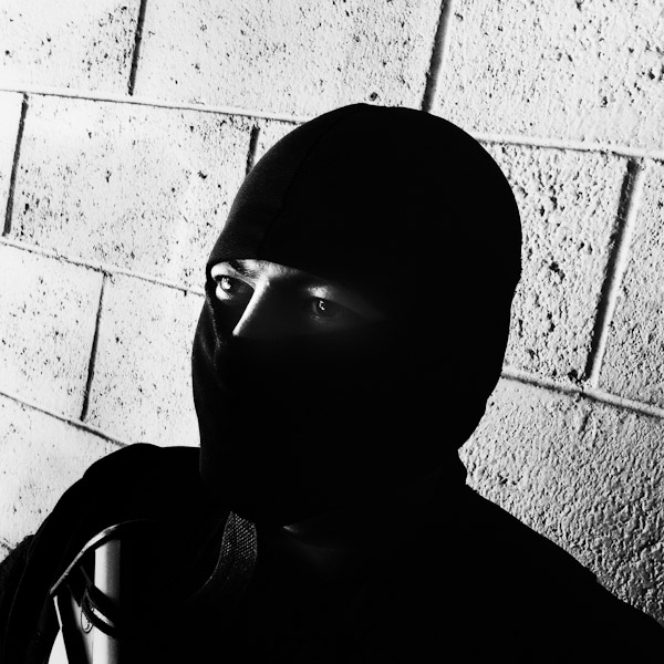 A member of the Police anti-gang unit, getting ready for an operation in the streets, stands on the base yard in San Salvador, El Salvador.